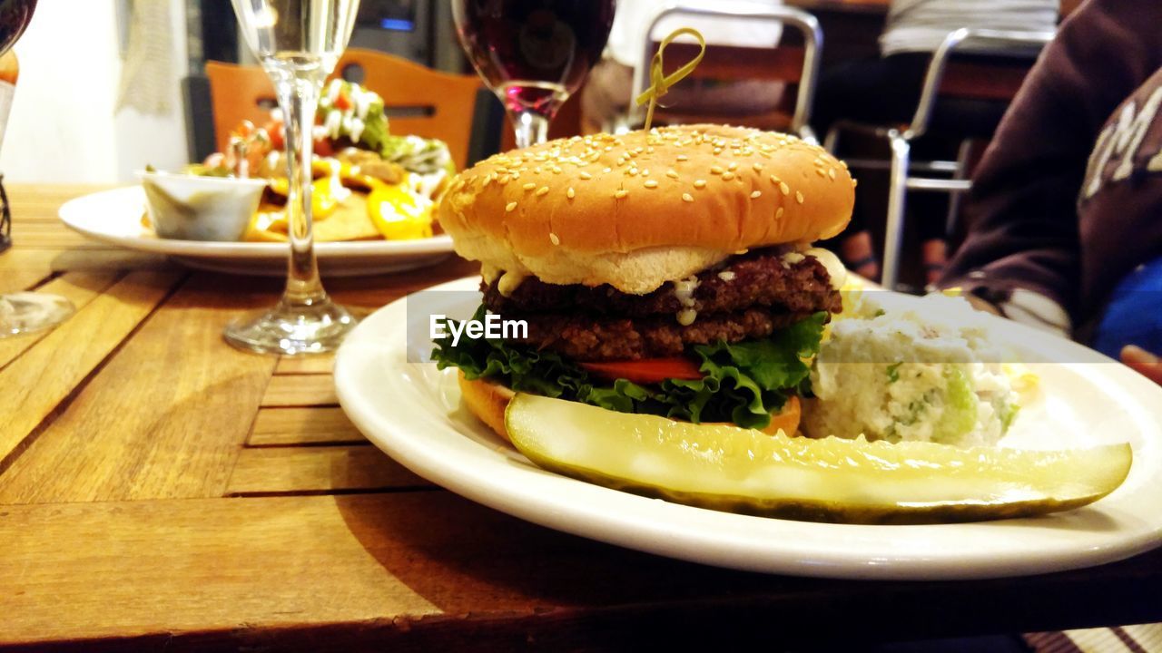 CLOSE-UP OF SERVED FOOD ON TABLE