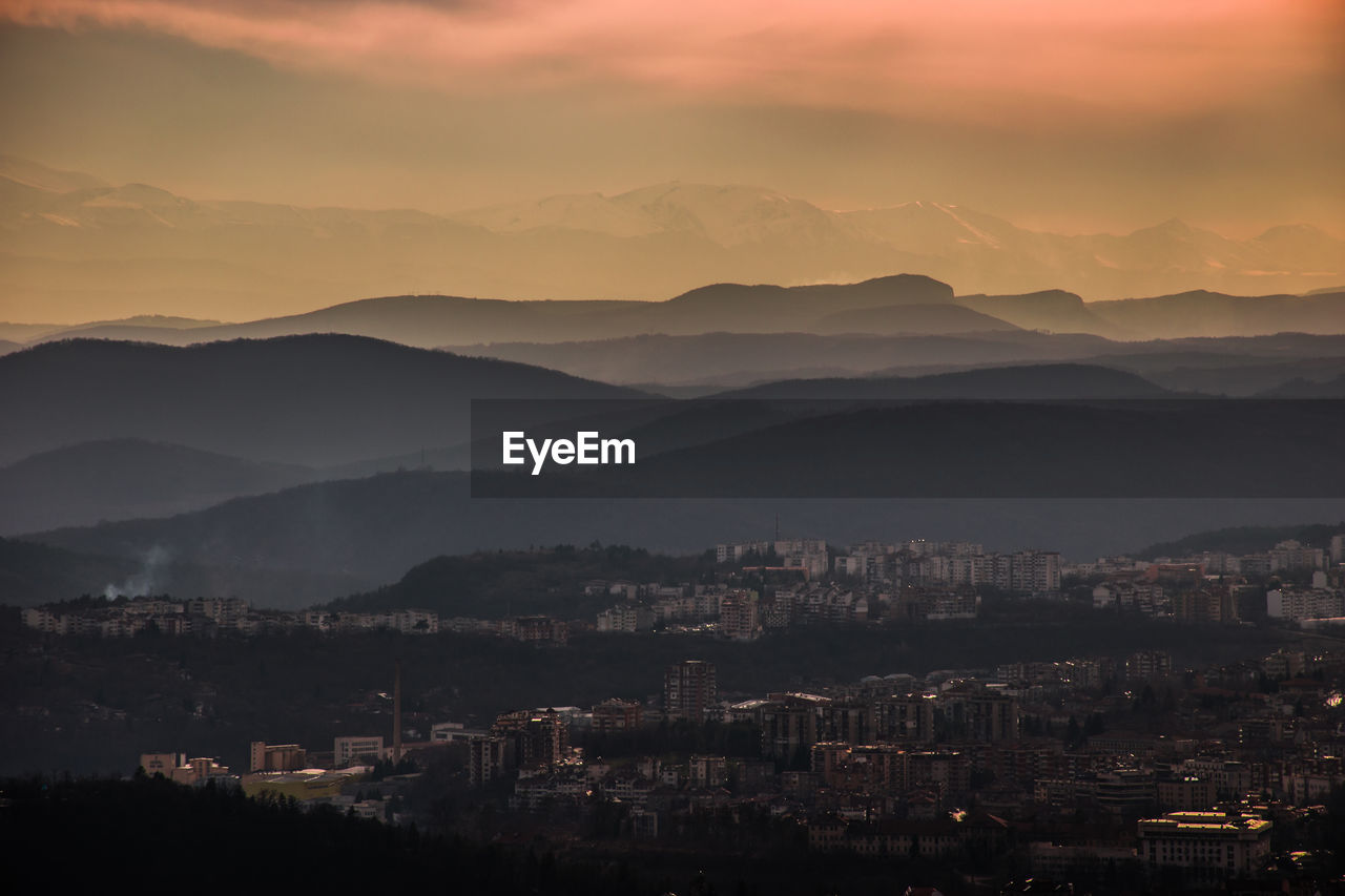 View of cityscape against sky during sunset