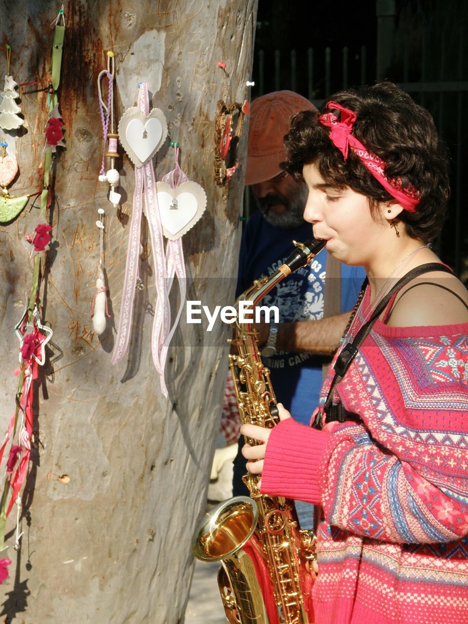 WOMAN SITTING IN TRADITIONAL CLOTHING