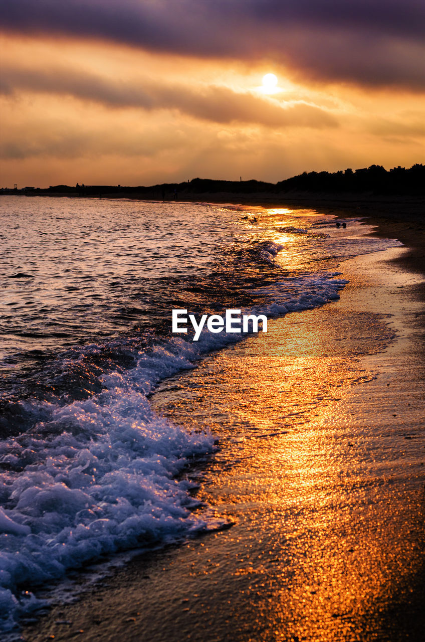 Scenic view of sea against dramatic sky