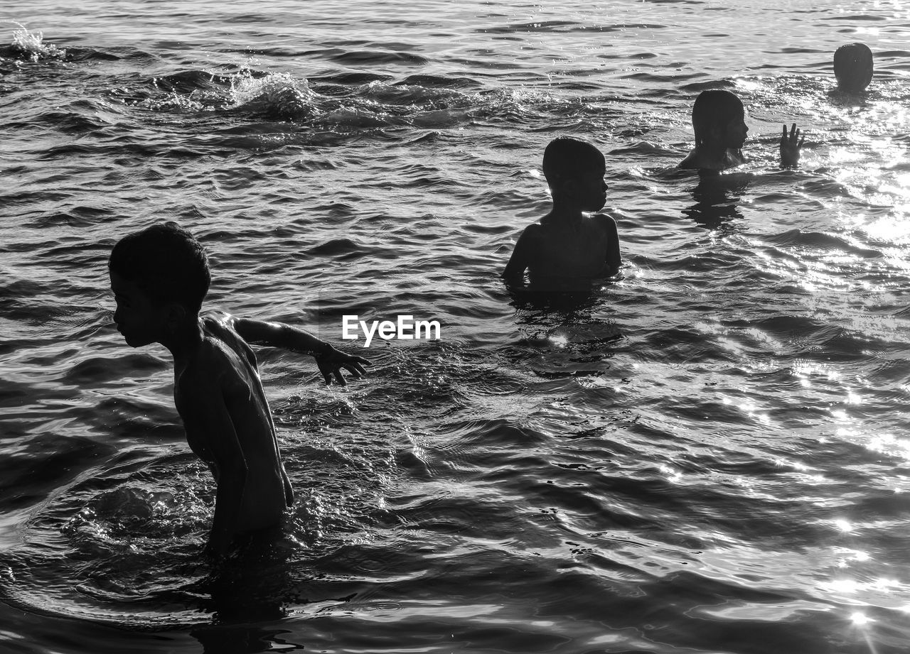 Children swimming in sea