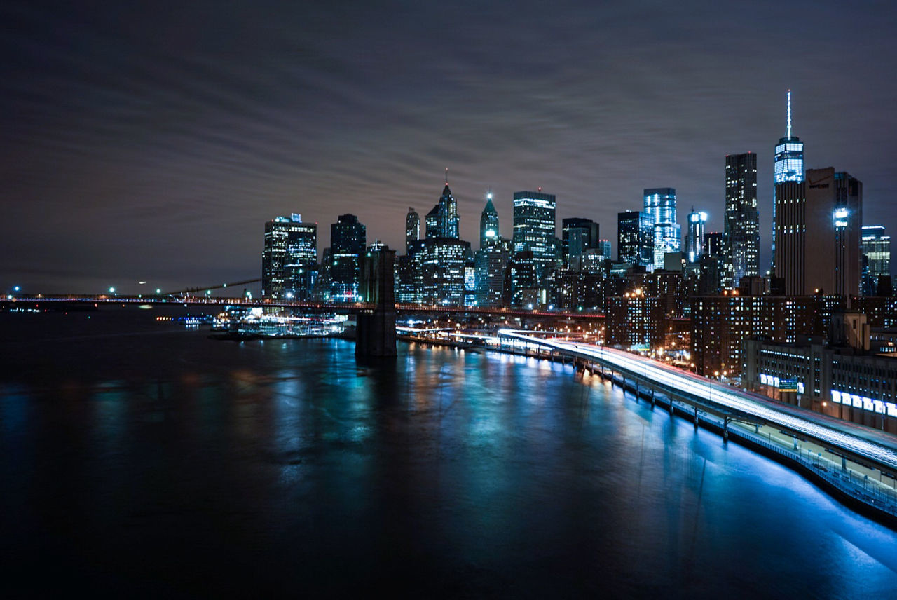 Brooklyn bridge over east river at night