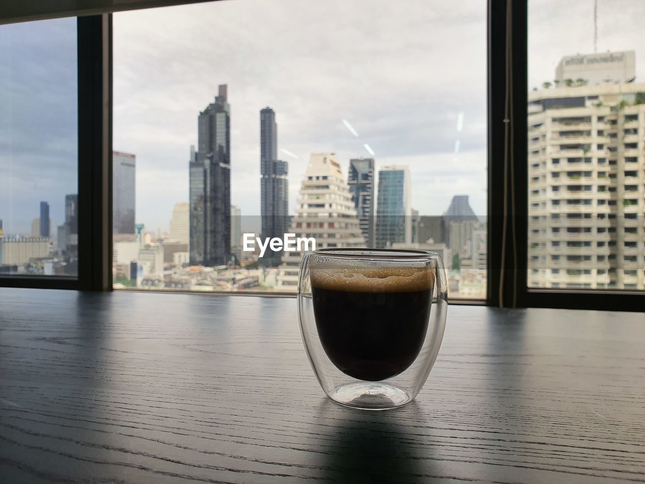 VIEW OF COFFEE AND BUILDINGS AGAINST SKY