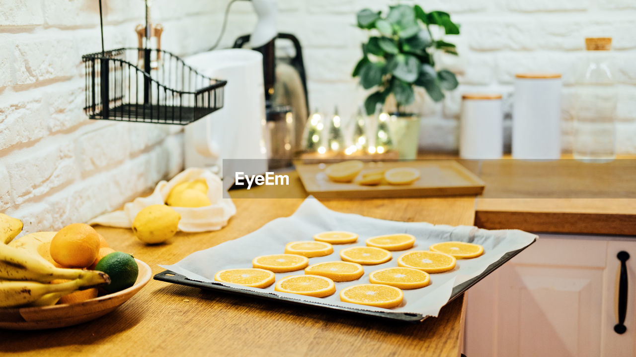 How to dry orange slices for eco friendly zero waste holiday decor. close up process of drying