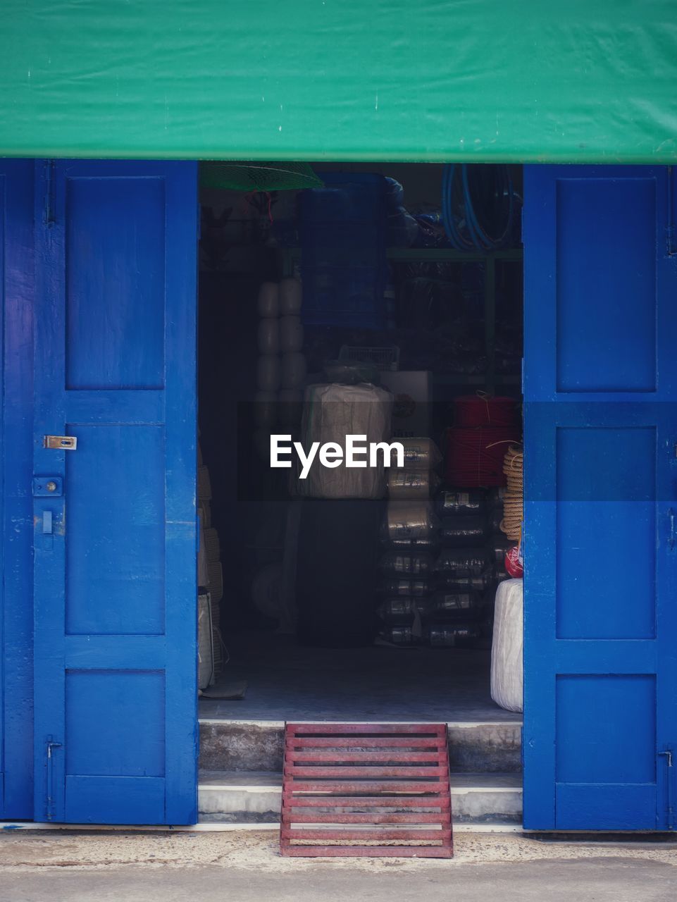 EXTERIOR OF BUILDING WITH BLUE CLOSED DOOR