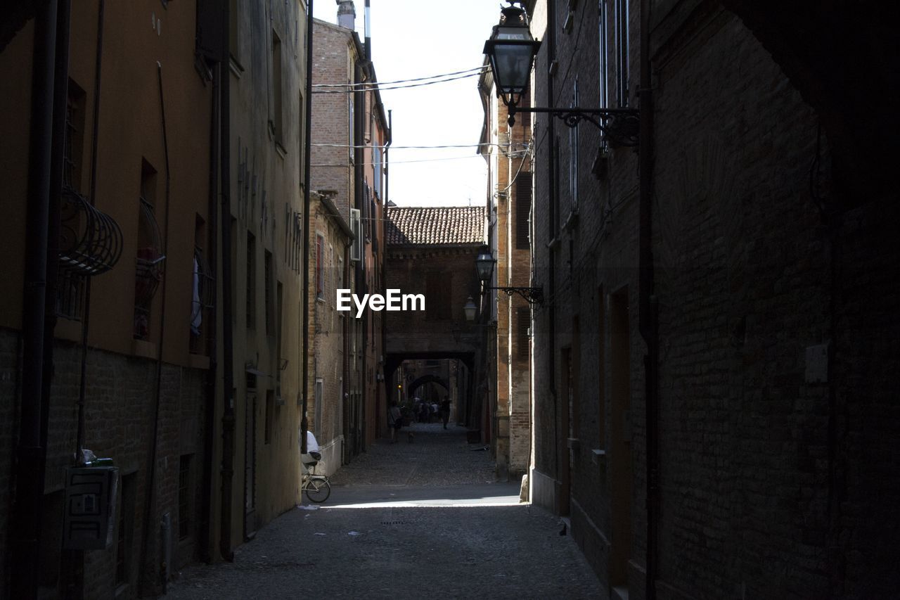 Narrow alley amidst buildings in city