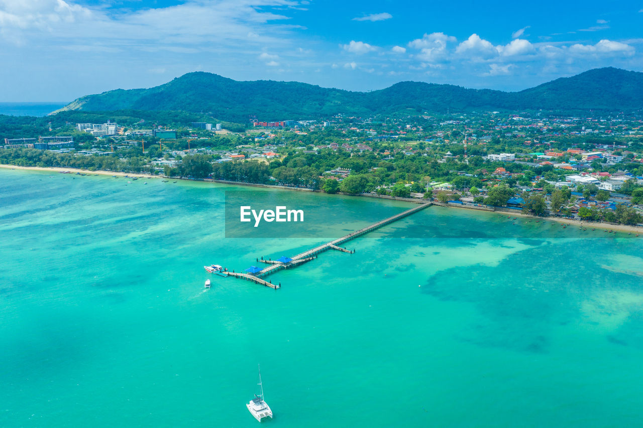 Aerial view drone shot of long tail boat at rawai beach,phuket t