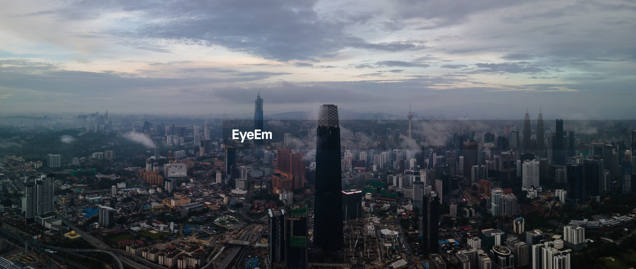 HIGH ANGLE VIEW OF CITY BUILDINGS AGAINST SKY