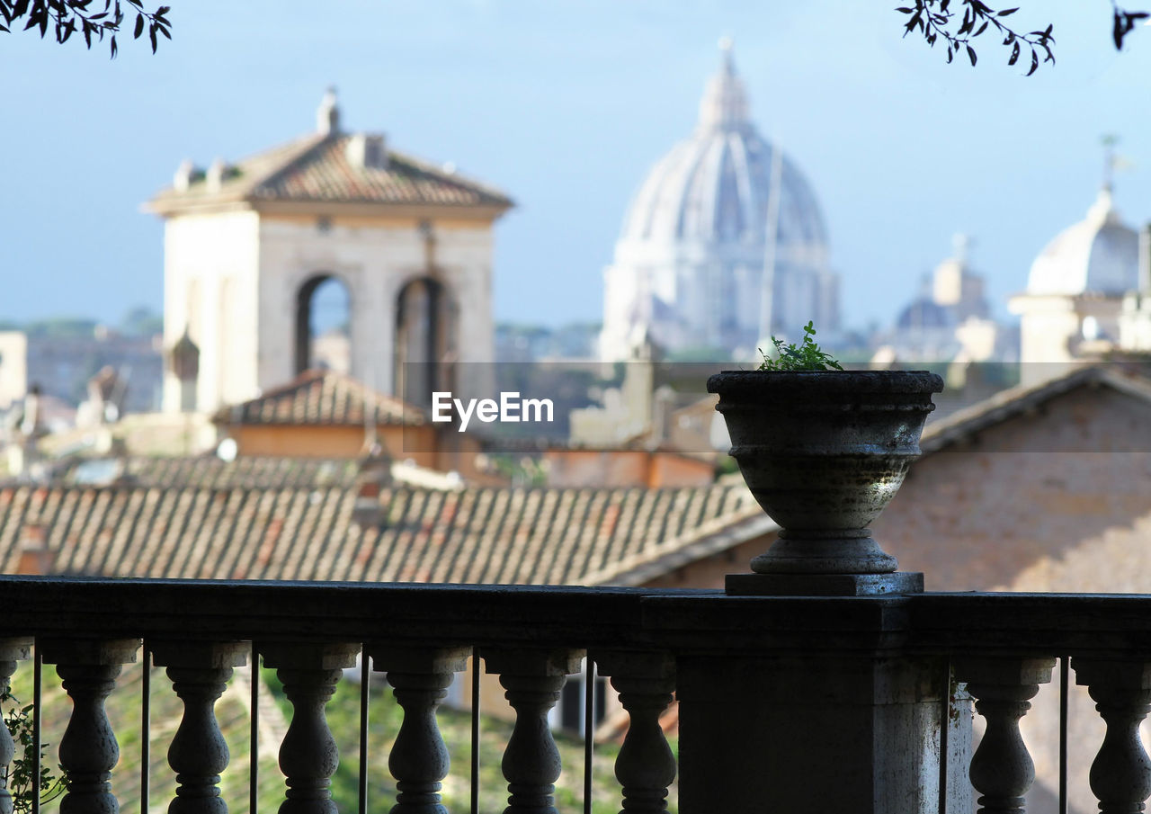 Panorama of rome, domes and roofs. in the center, the dome of st. peter's basilica.