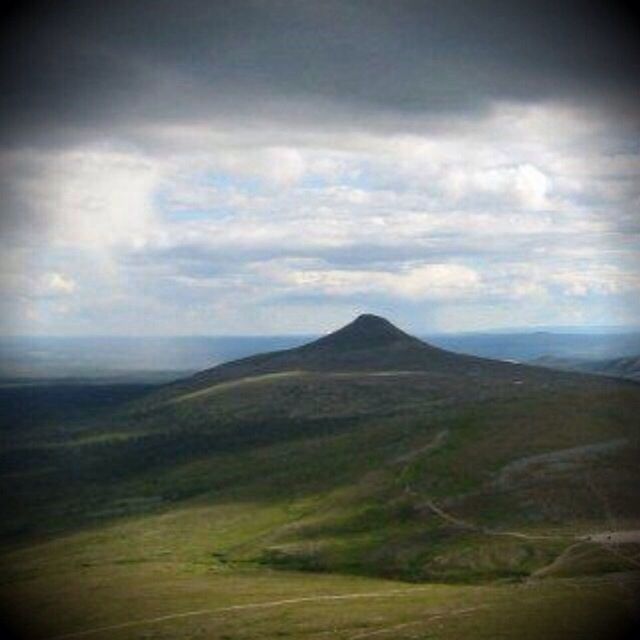 SCENIC VIEW OF MOUNTAIN AGAINST CLOUDY SKY