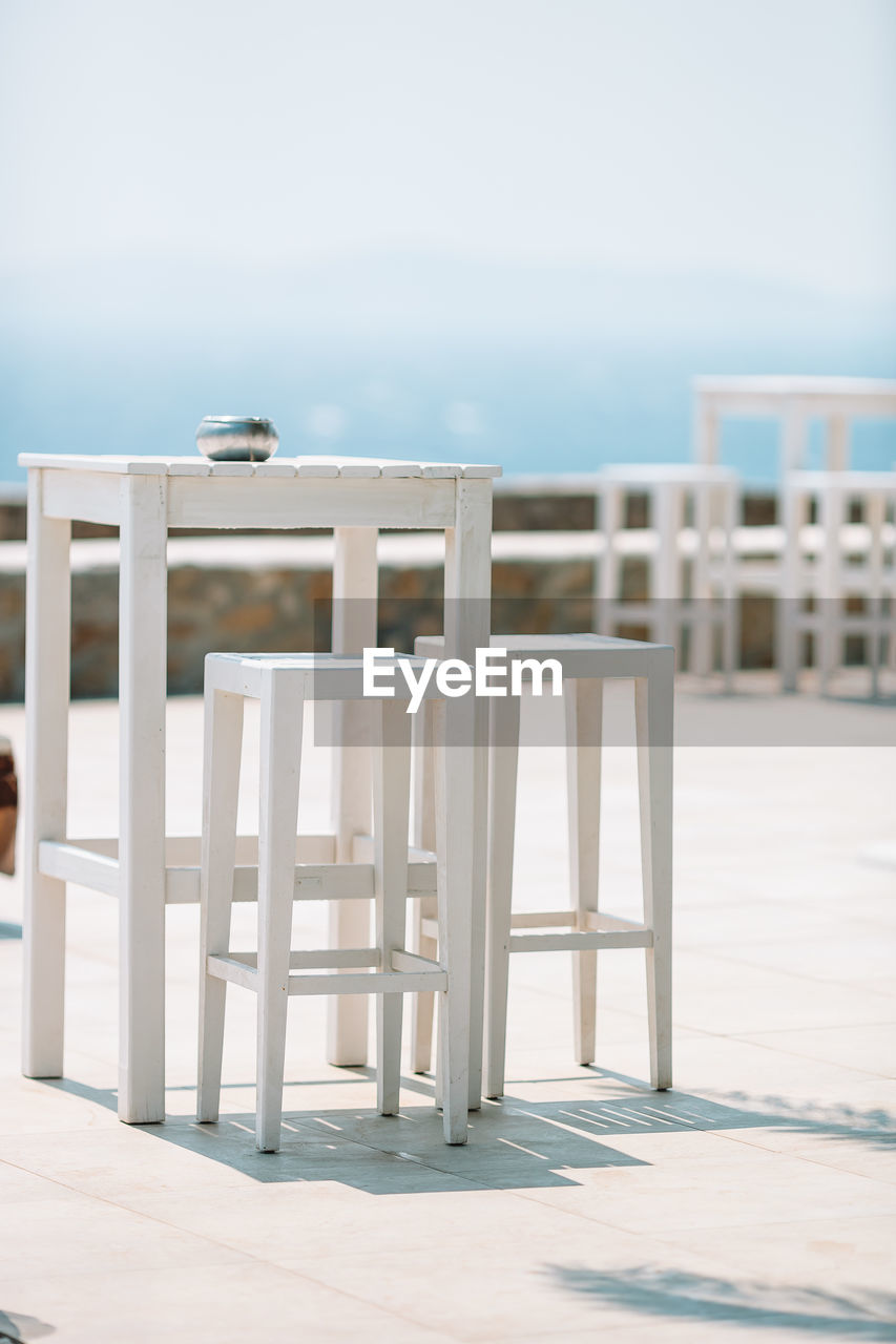 CHAIRS ON BEACH AGAINST SEA