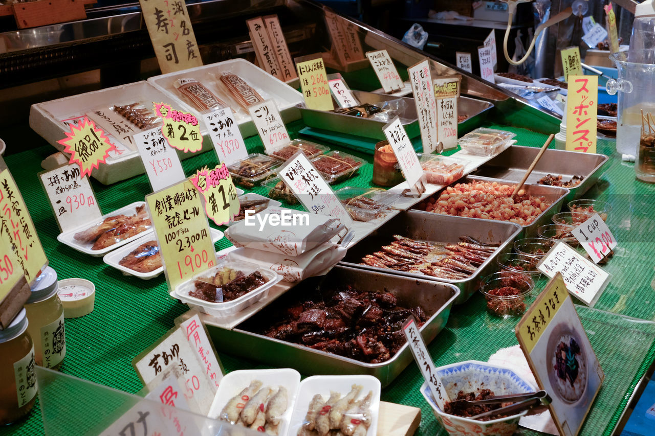 market, public space, food and drink, city, food, variation, retail, for sale, high angle view, market stall, large group of objects, freshness, abundance, business, no people, arrangement, price tag, meal, container, healthy eating, still life, wellbeing, seafood