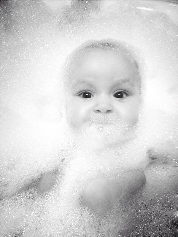High angle view of baby covered in bath foam