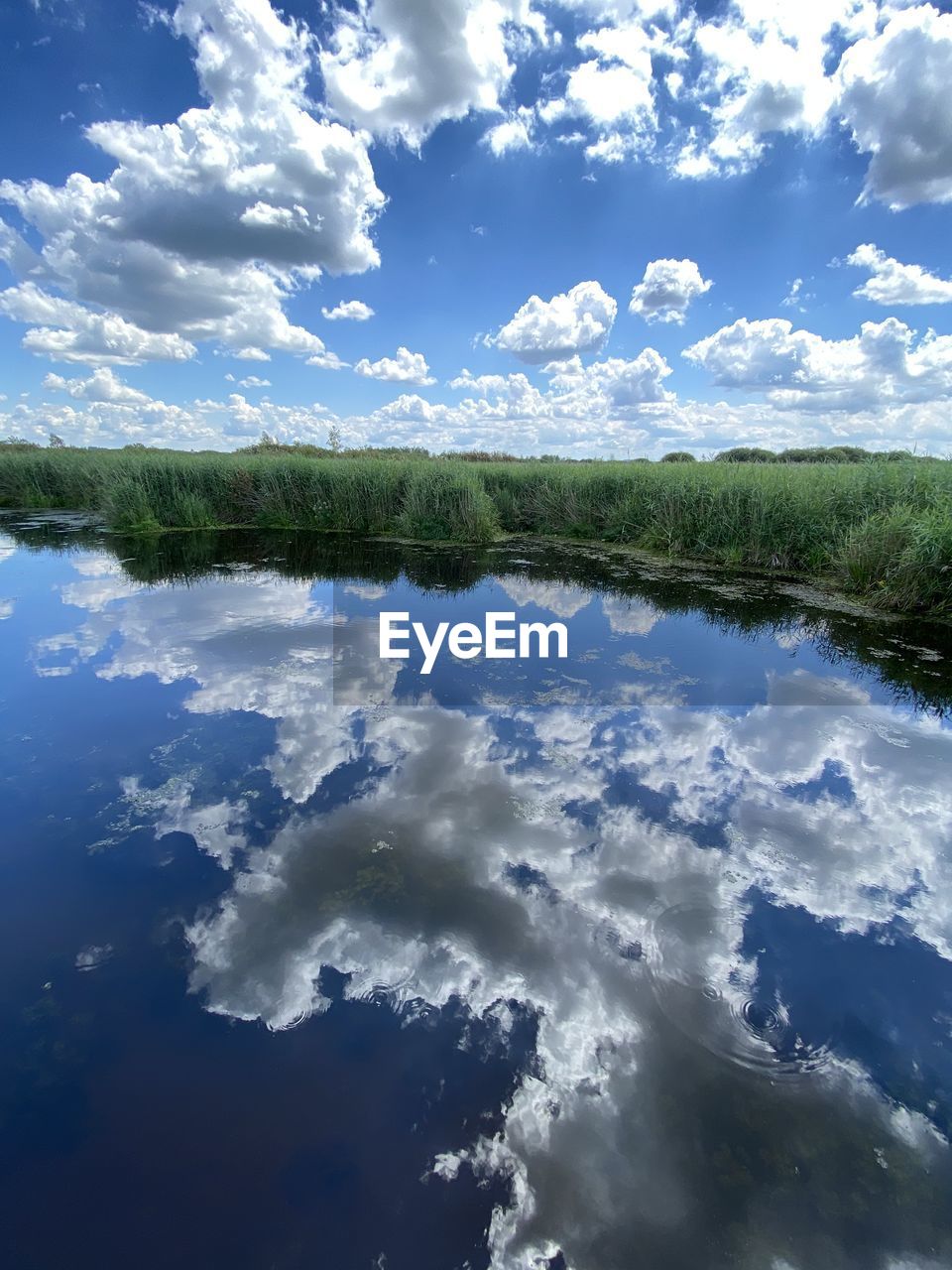 sky, cloud, reflection, sunlight, nature, blue, beauty in nature, no people, environment, water, day, scenics - nature, outdoors, tranquility, wave, earth, cloudscape