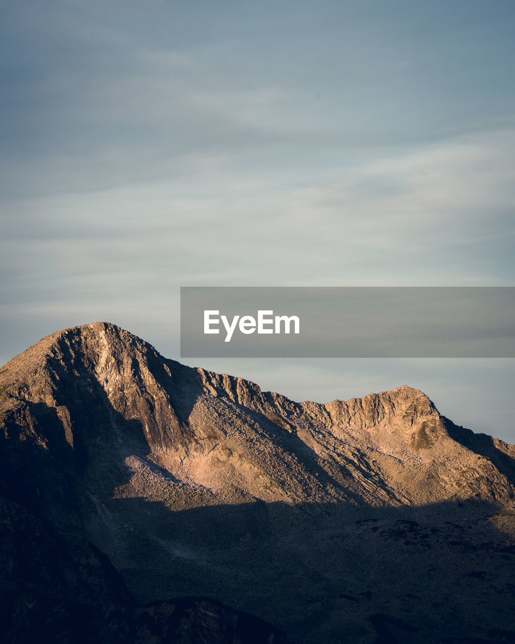 Rocky mountain against sky