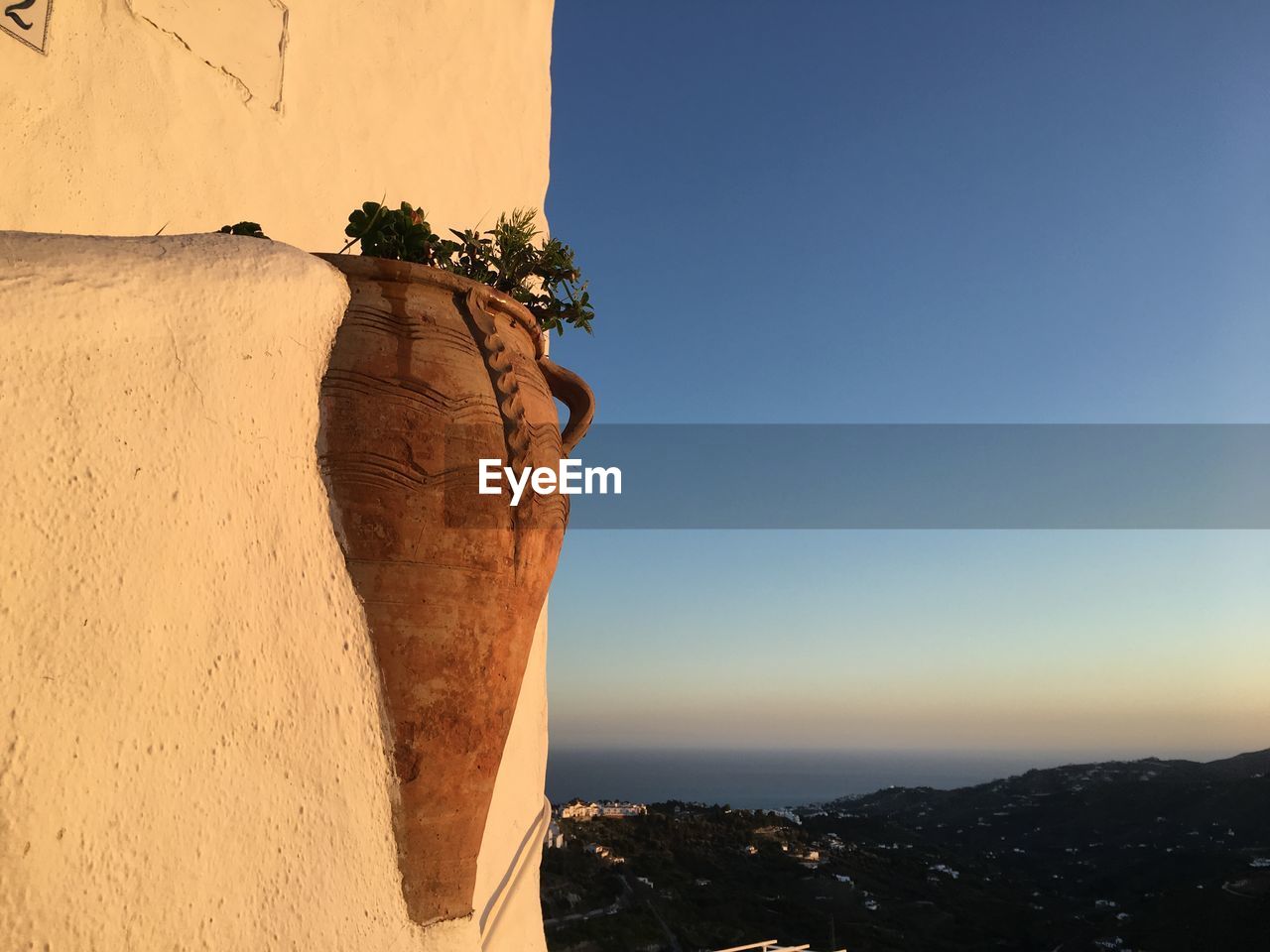 STONE WALL OF BUILDING AGAINST SKY