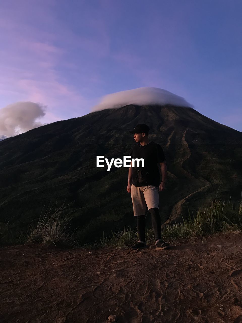 Full length of man standing against mountain