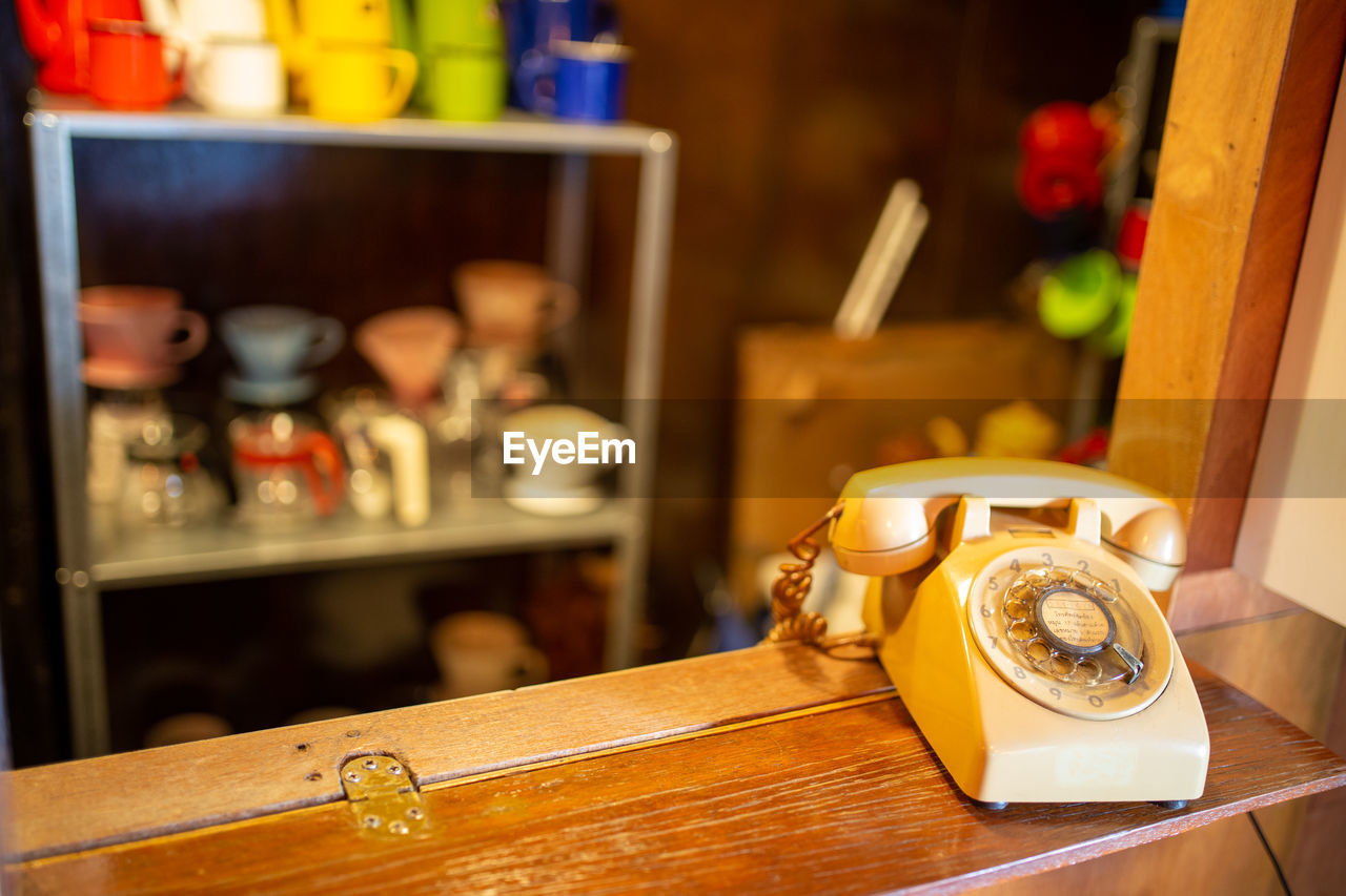 Close-up of old telephone on table