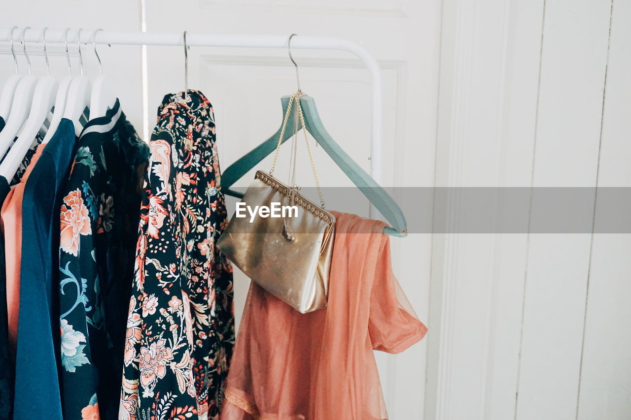 Close-up of clothes hanging on rack at home