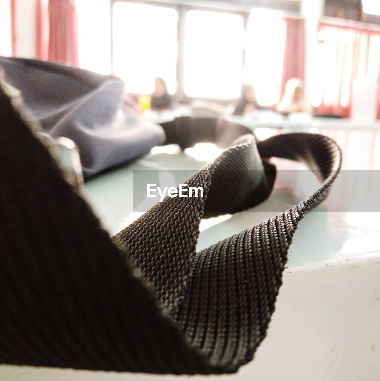 CLOSE-UP OF SHOES ON TABLE