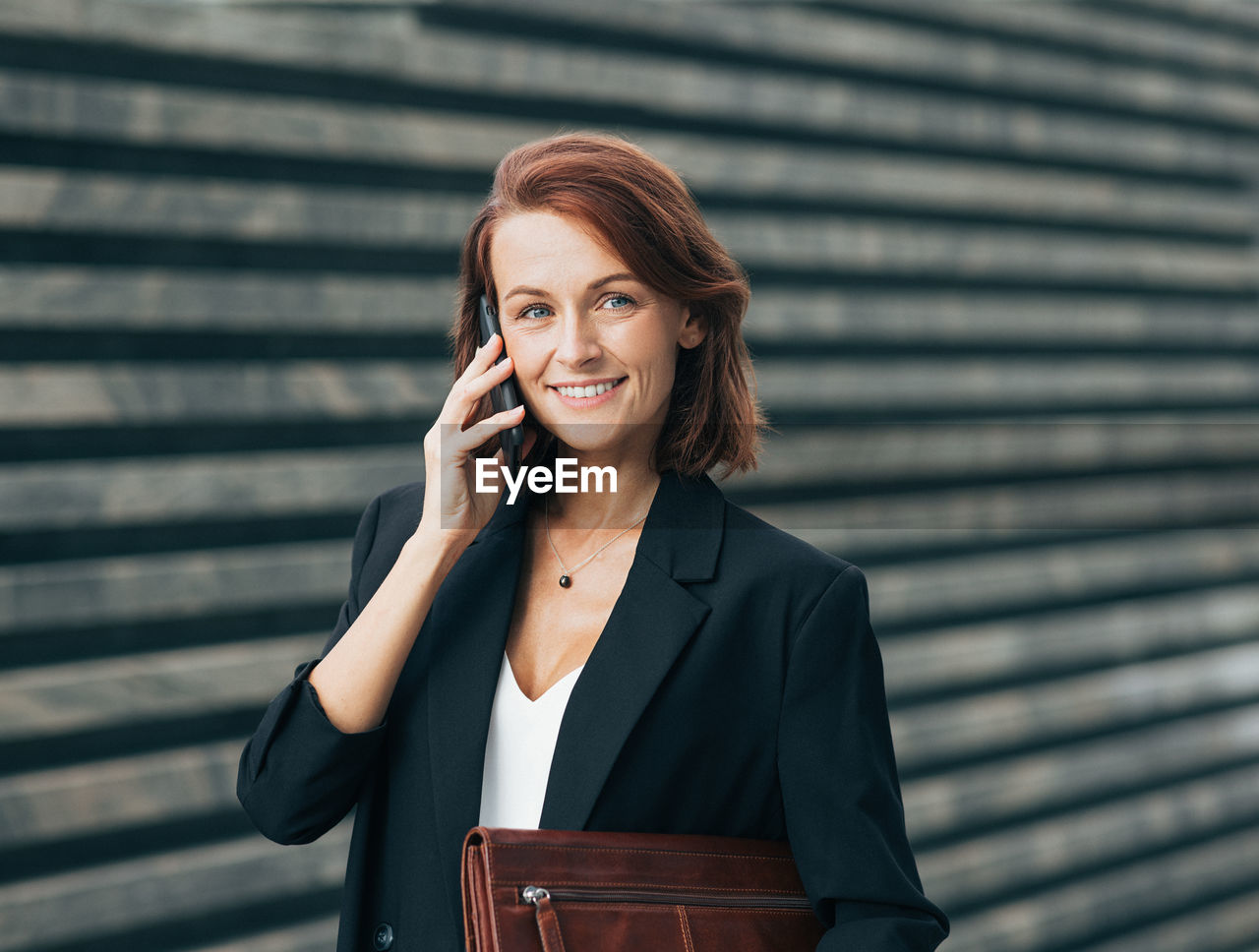 portrait of young woman using mobile phone