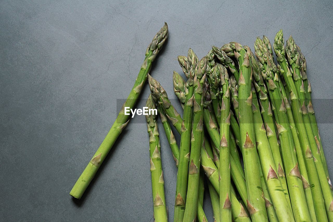 High angle view of vegetables on table, green asparagus