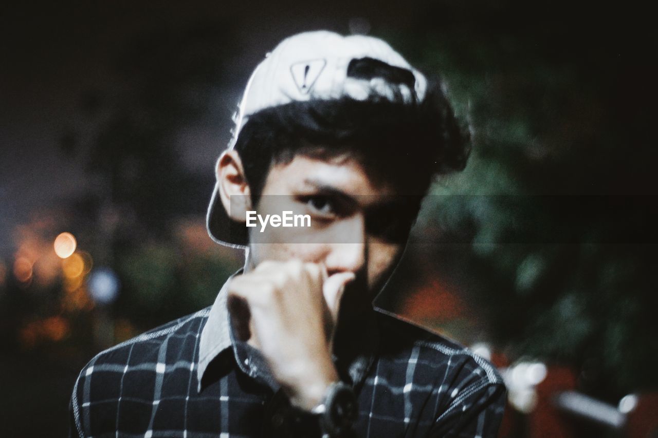 CLOSE-UP PORTRAIT OF A MAN WEARING MASK