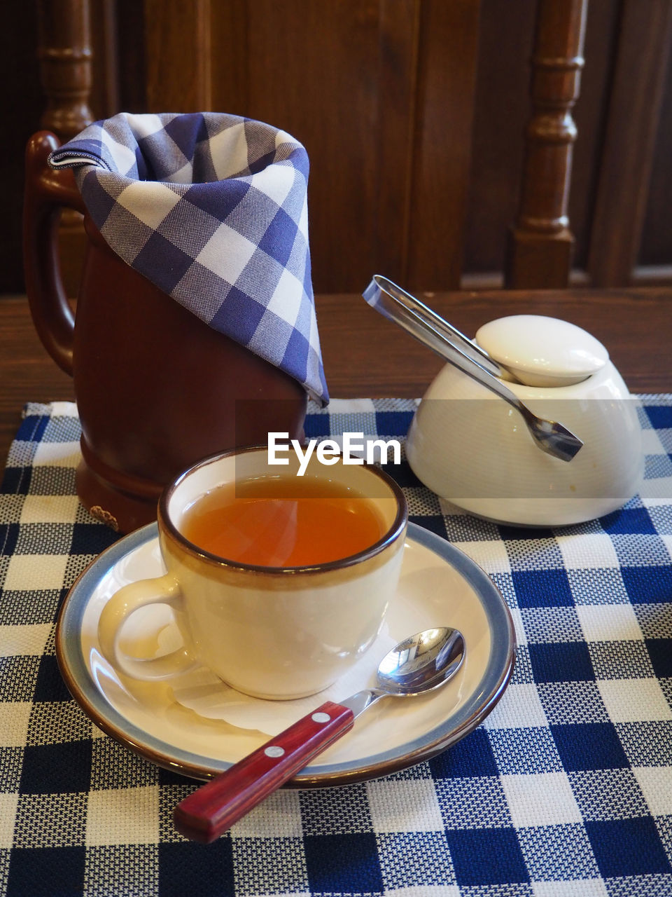 CUP OF TEA ON TABLE AT KITCHEN