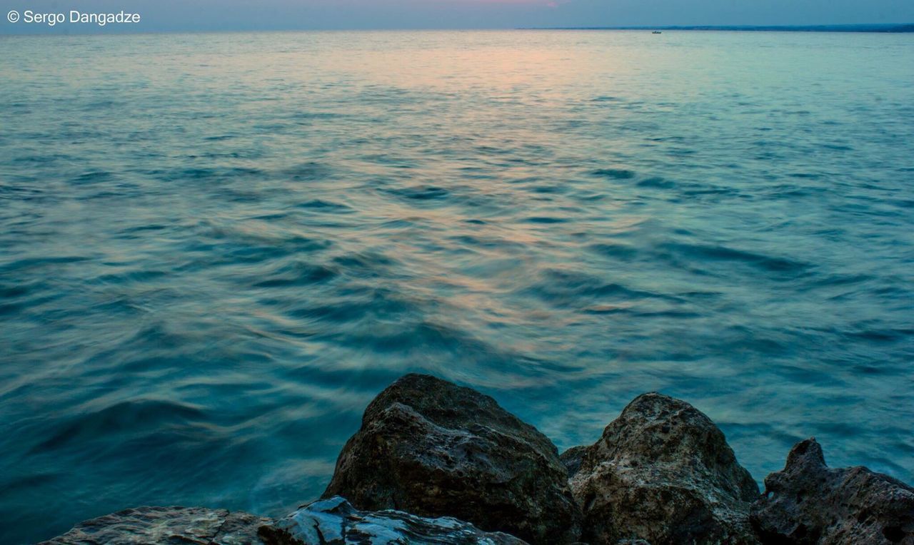 CLOSE-UP OF RIPPLED SEA AGAINST SKY