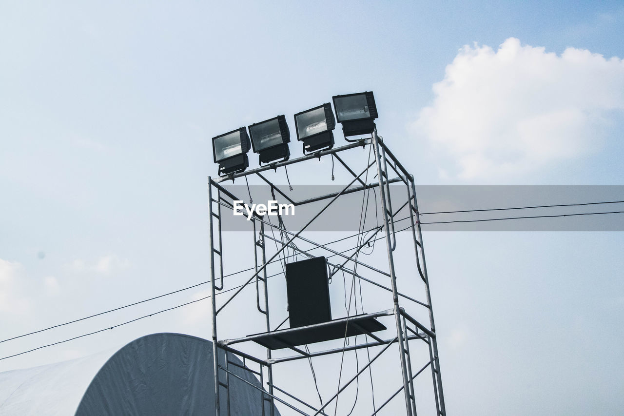 LOW ANGLE VIEW OF WATER TOWER AGAINST SKY SEEN FROM BUILDING