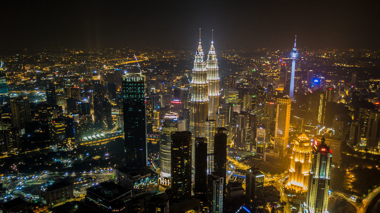 Aerial view of illuminated cityscape at night