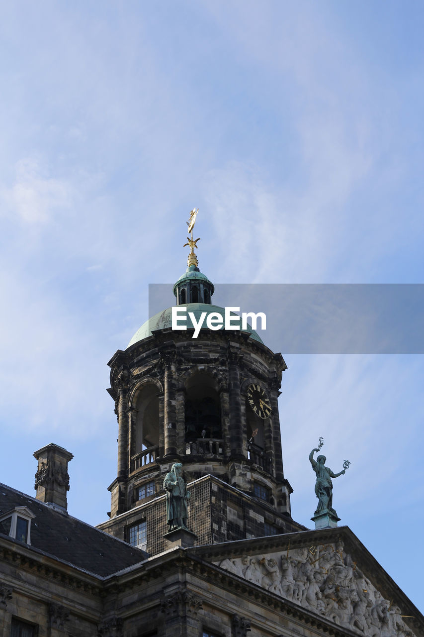 View of the top of the royal palace amsterdam at the dam square in sunny day