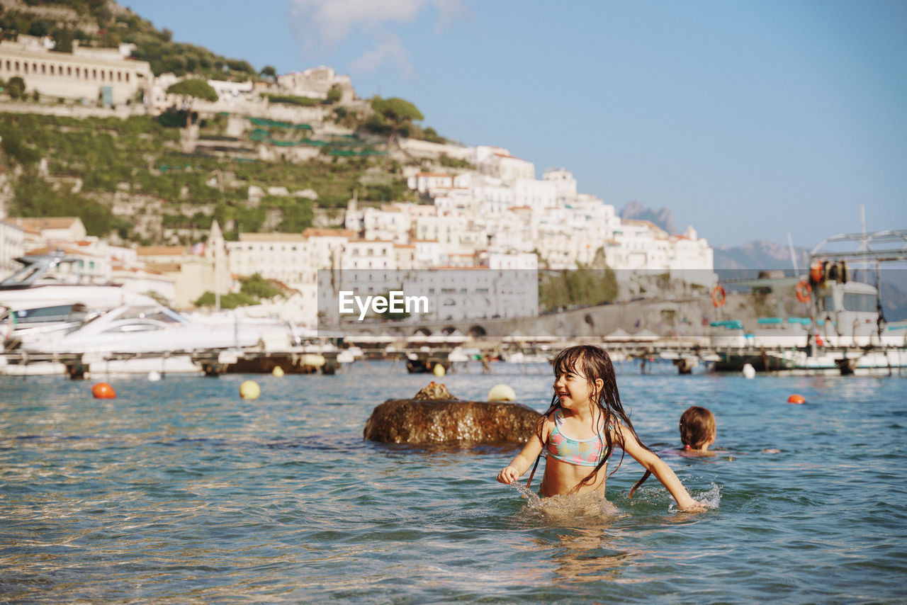 Side view of girl swimming in sea