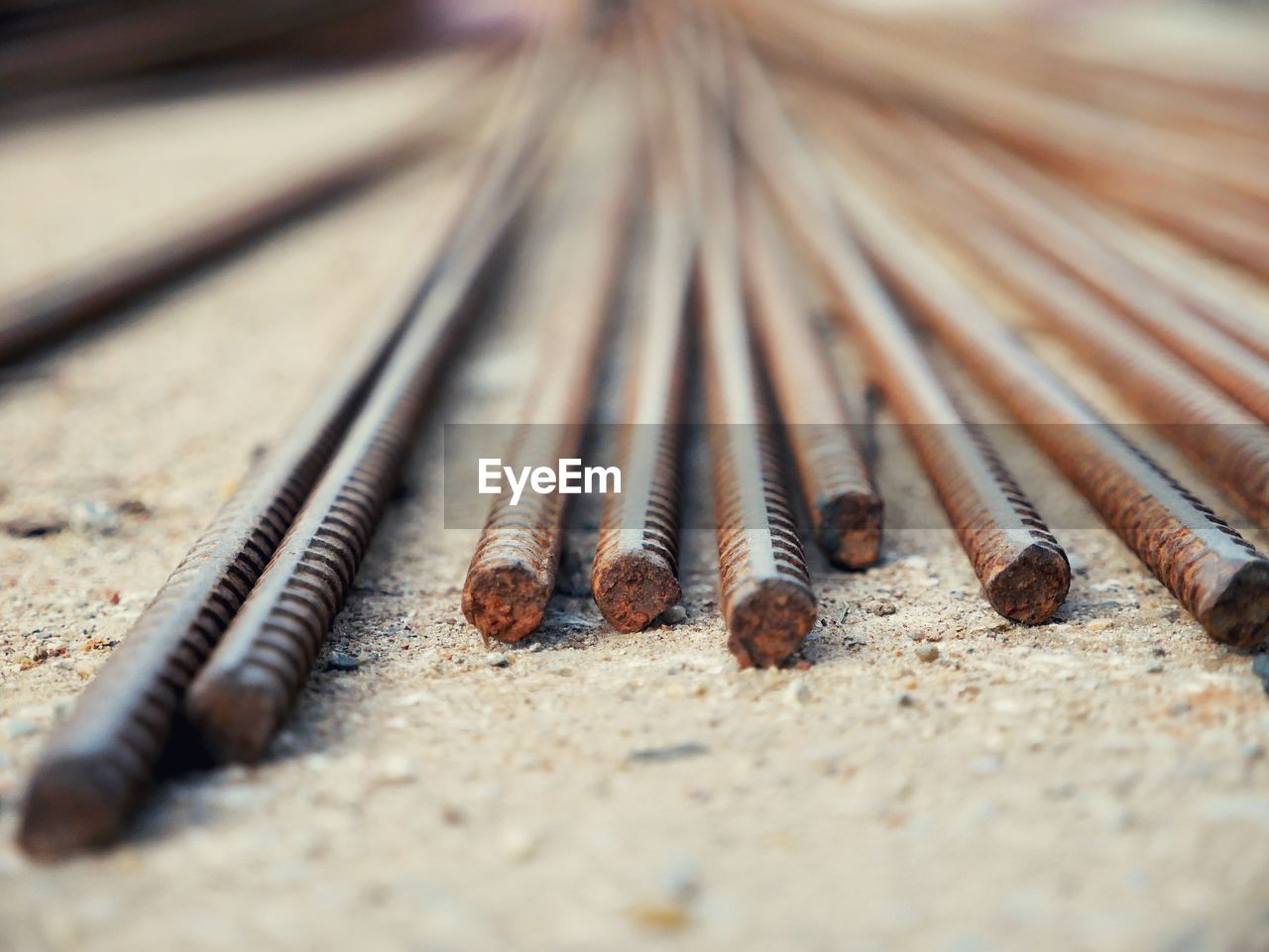 Close-up of rusty metal rods at construction site