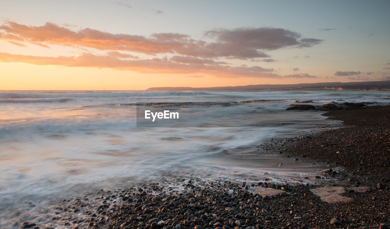 Scenic view of sea against sky during sunset