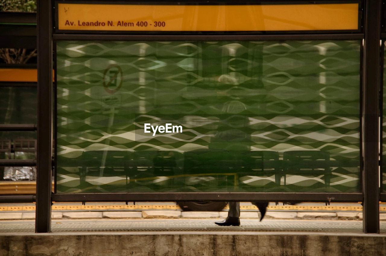 REFLECTION OF BUILDINGS ON GLASS WINDOW