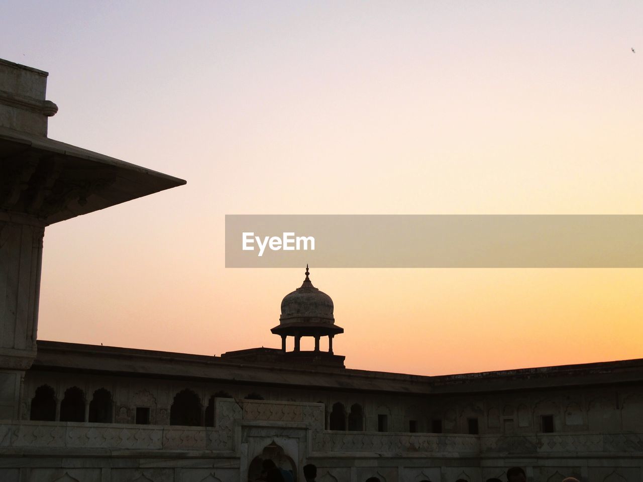 HIGH SECTION OF BUILT STRUCTURE AGAINST CLEAR SKY AT SUNSET