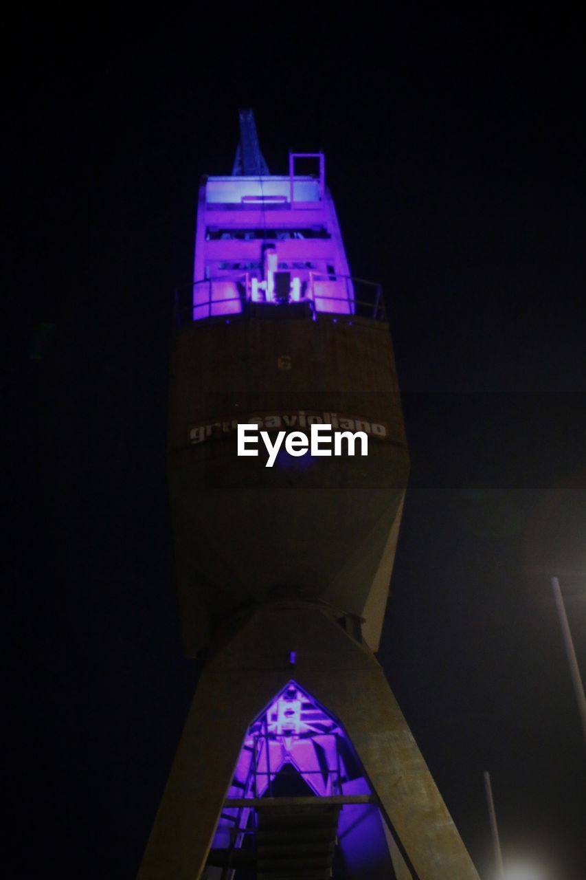 LOW ANGLE VIEW OF CLOCK TOWER AGAINST BUILDING