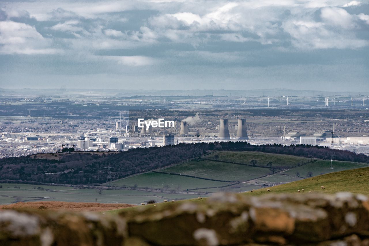 Aerial view of cityscape against sky