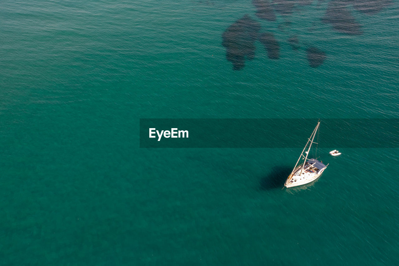 Aerial view of a luxury yacht anchored in the surface of the sea. cyprus vacations