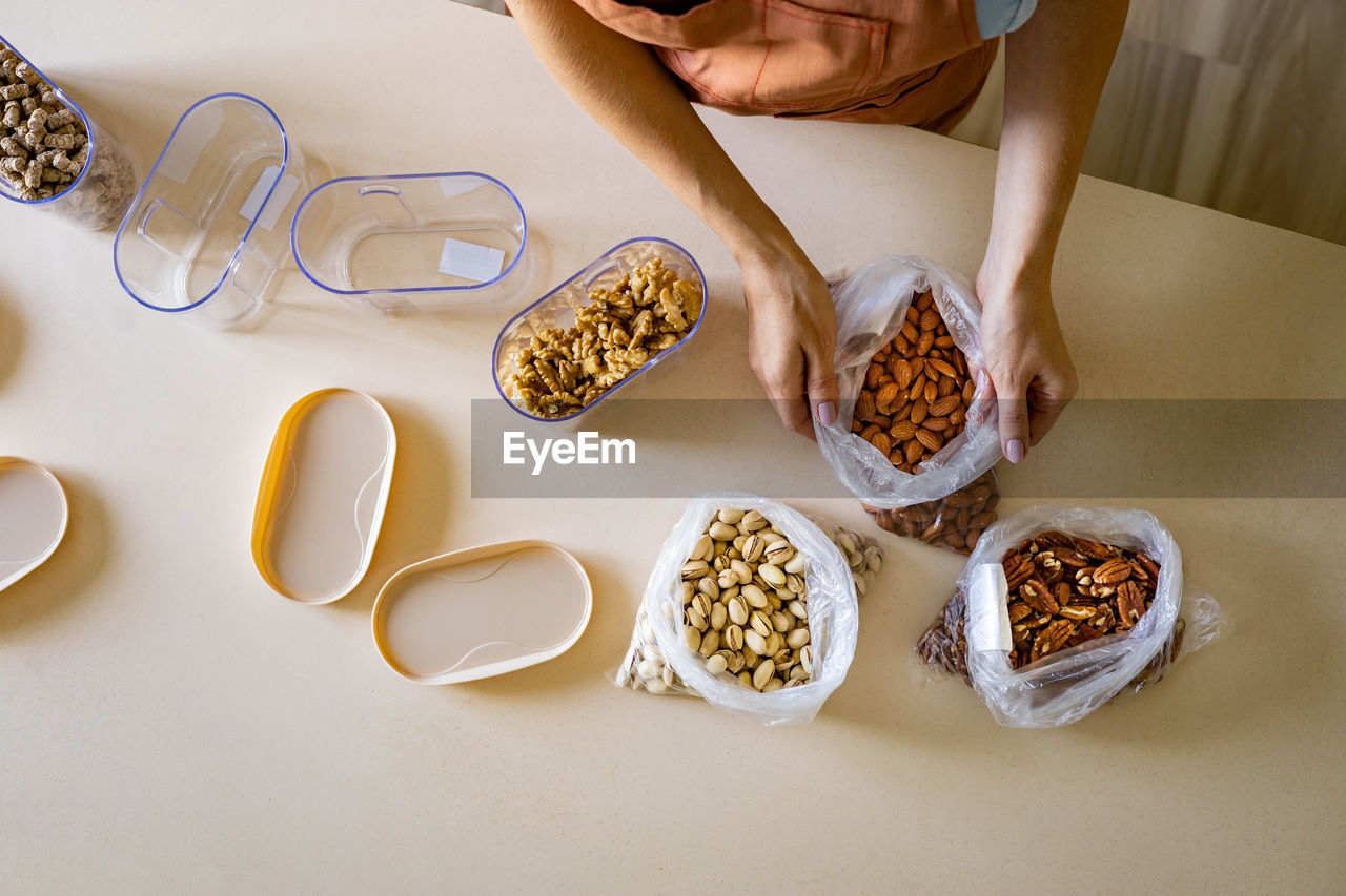 High angle view of woman preparing food on table