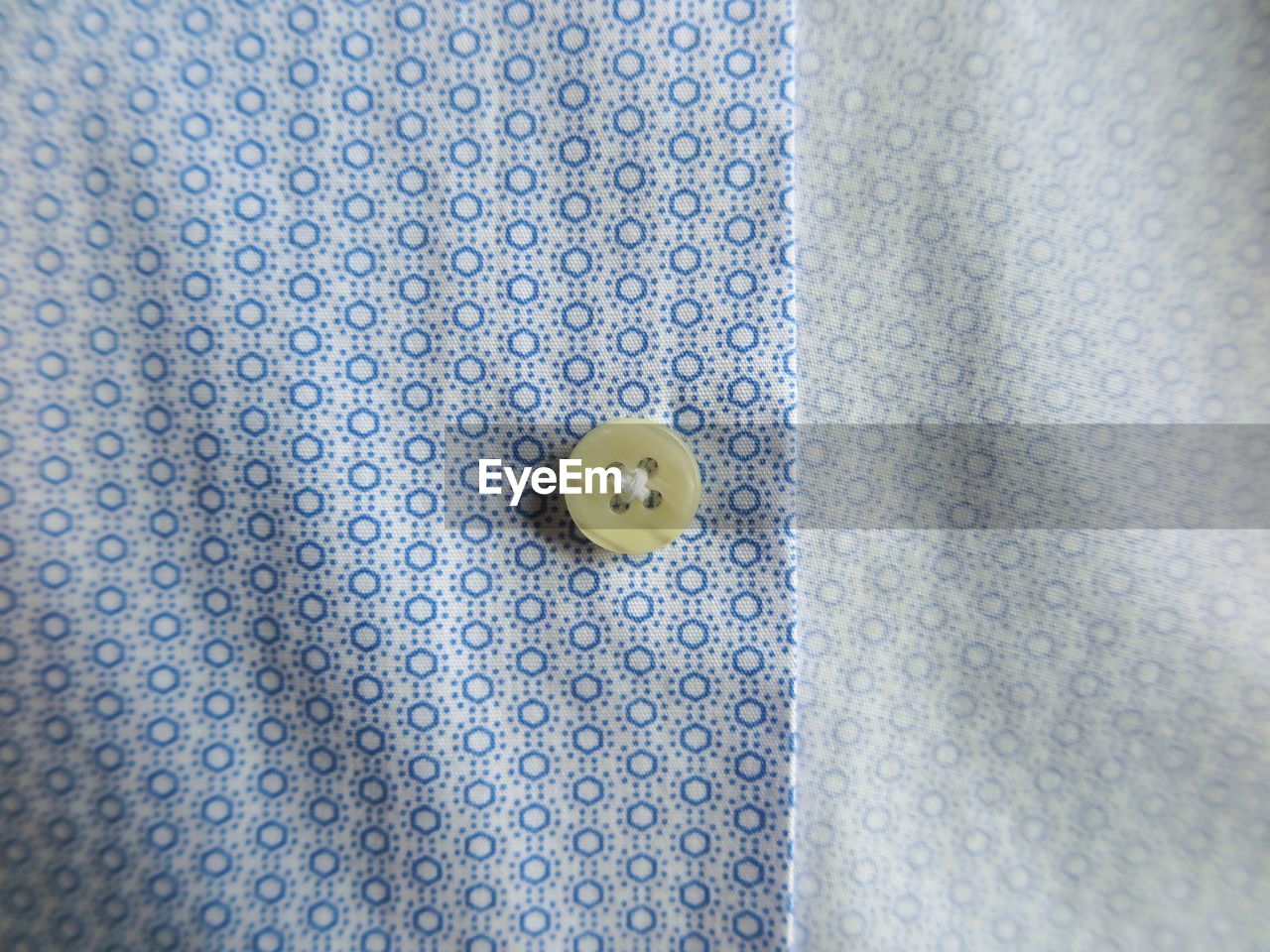 Close-up of button on shirt