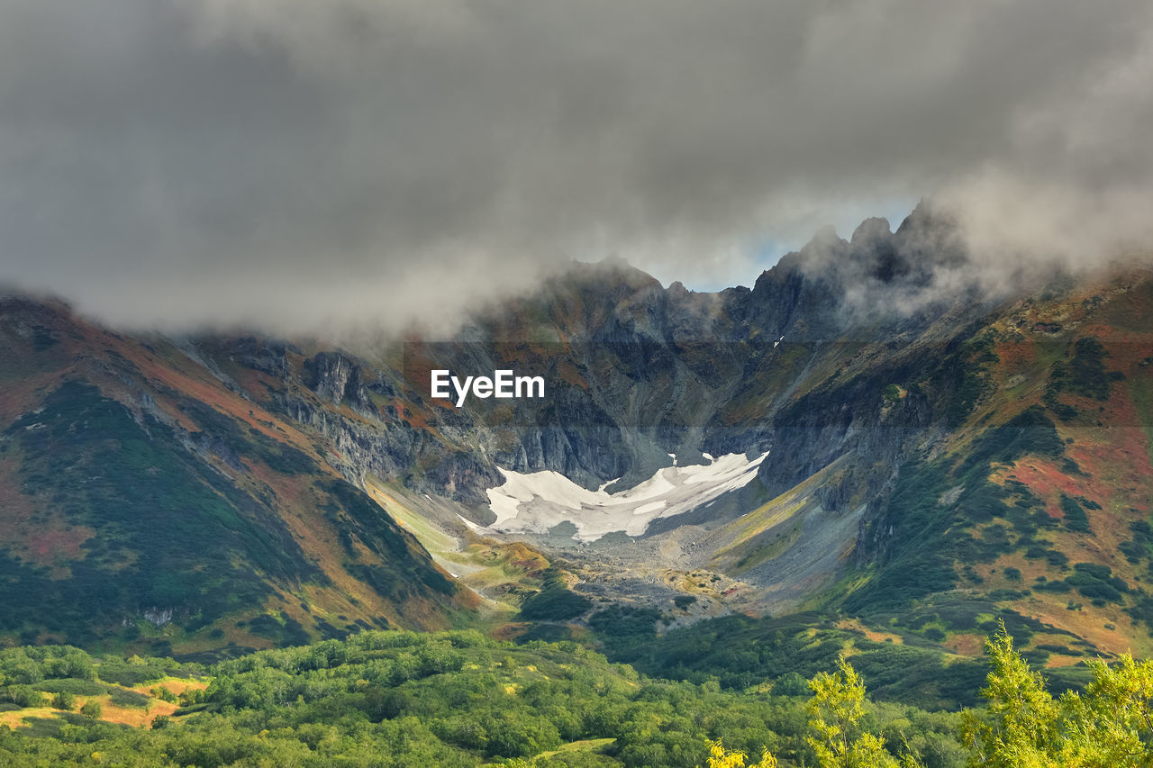 SCENIC VIEW OF MOUNTAINS AGAINST SKY DURING SUNSET