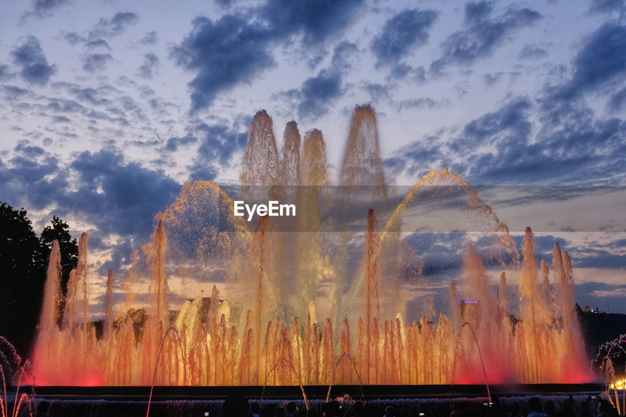 Digital composite image of trees and plants on field against sky