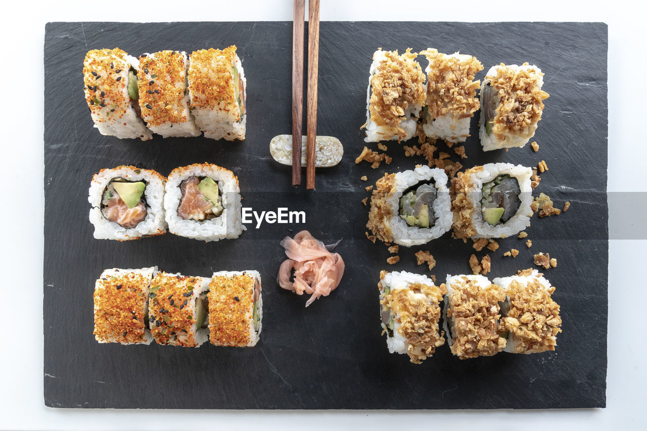 HIGH ANGLE VIEW OF SUSHI SERVED ON TABLE