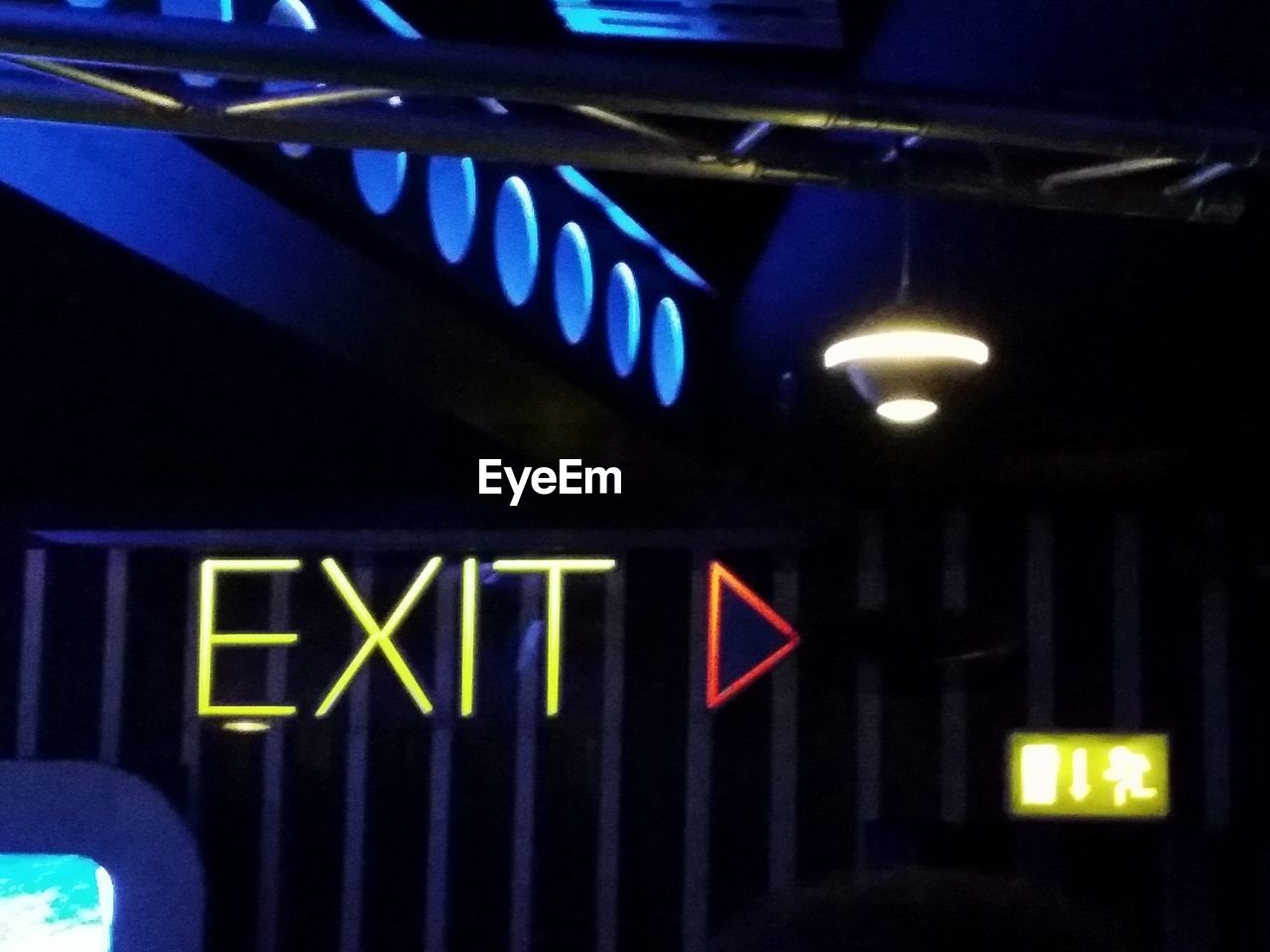 Close-up of illuminated exit neon sign 