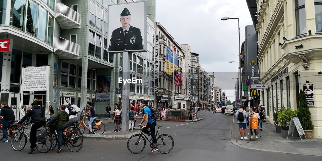 PEOPLE ON STREET IN CITY