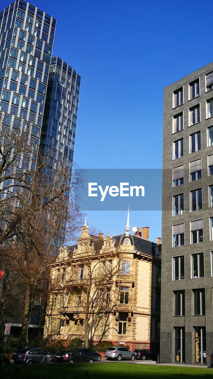 VIEW OF APARTMENT BUILDINGS AGAINST SKY