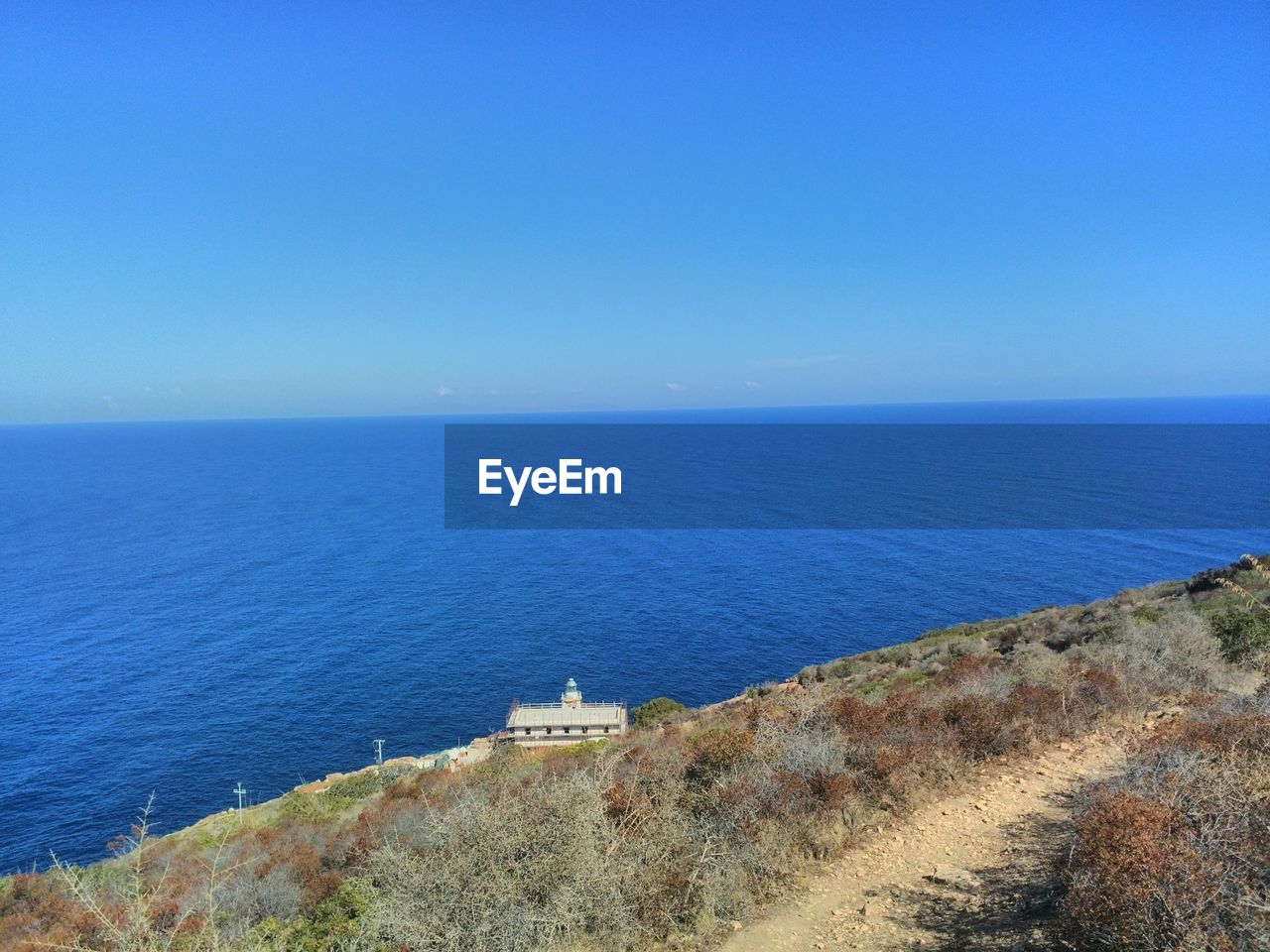 SCENIC VIEW OF SEA AGAINST BLUE SKY