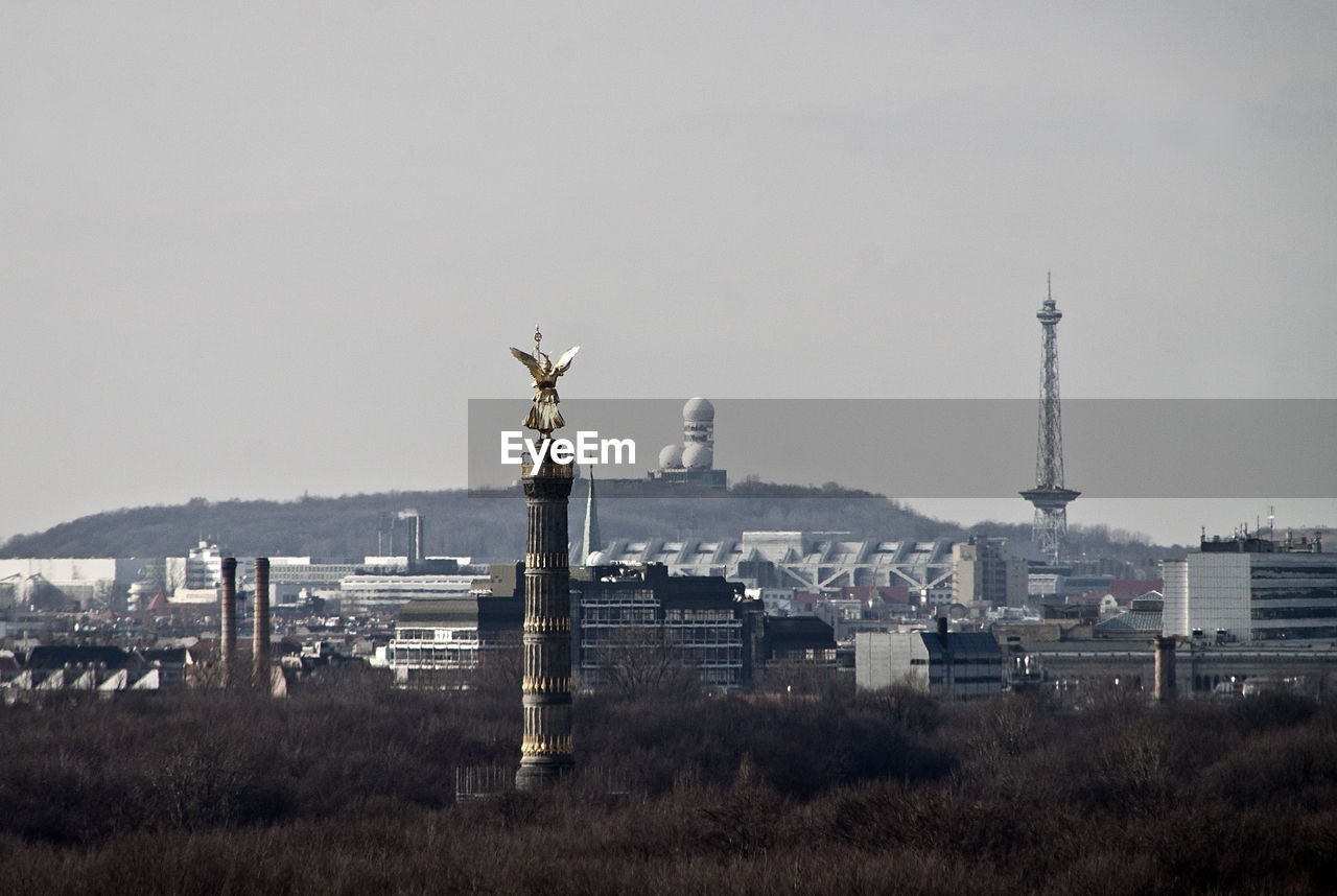 Victory column against buildings in city